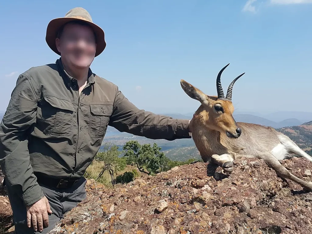 Hunting Mountain Reedbuck - hunter with a mountain Reedbuck trophy.