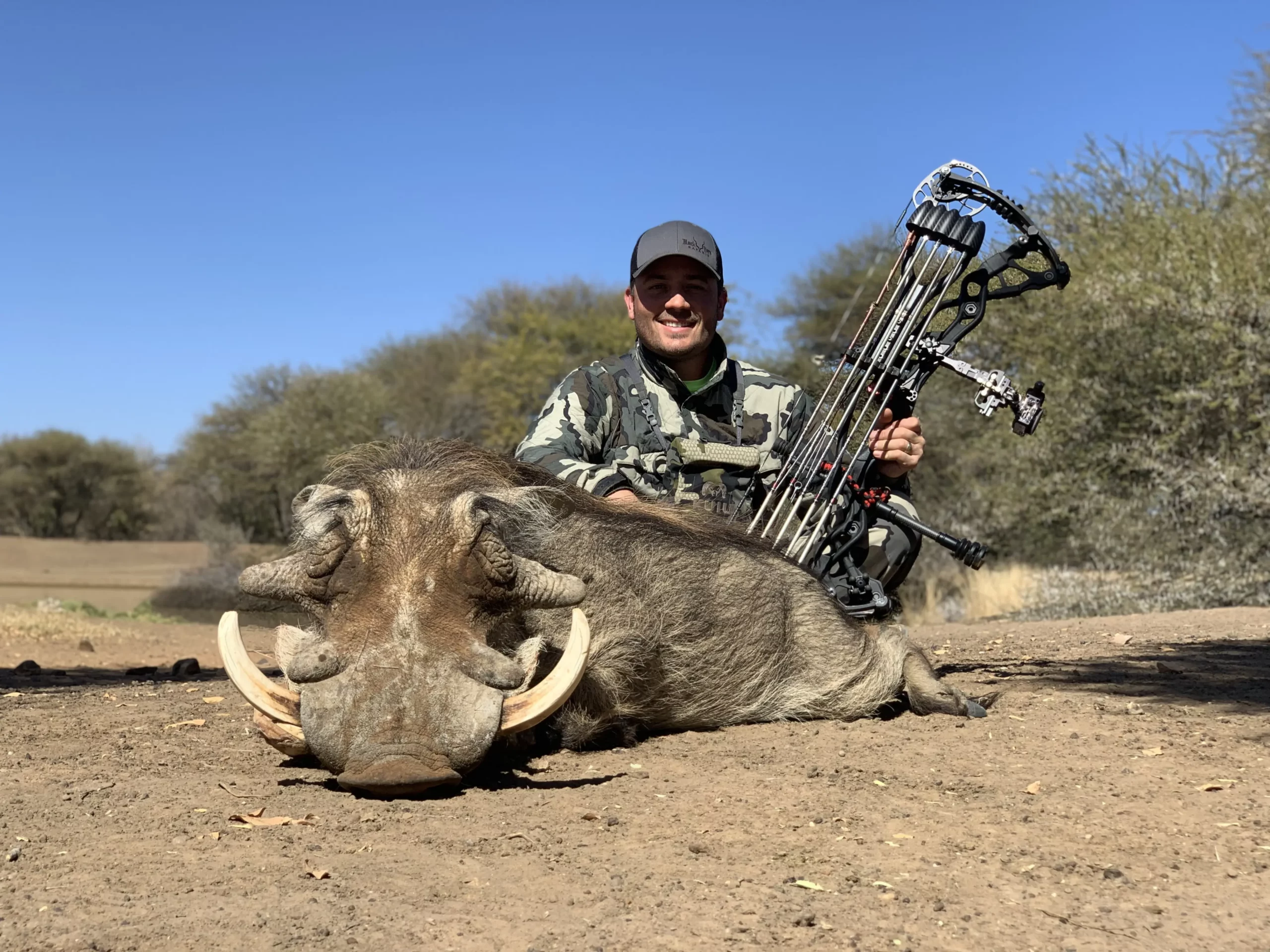 Unique bow hunting safari in South Africa - hunter with Warthog trophy