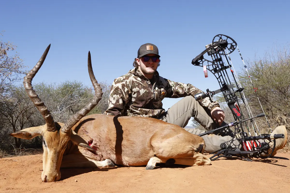 Price to bow hunt Impala in South Africa - Bow hunter with Impala trophy